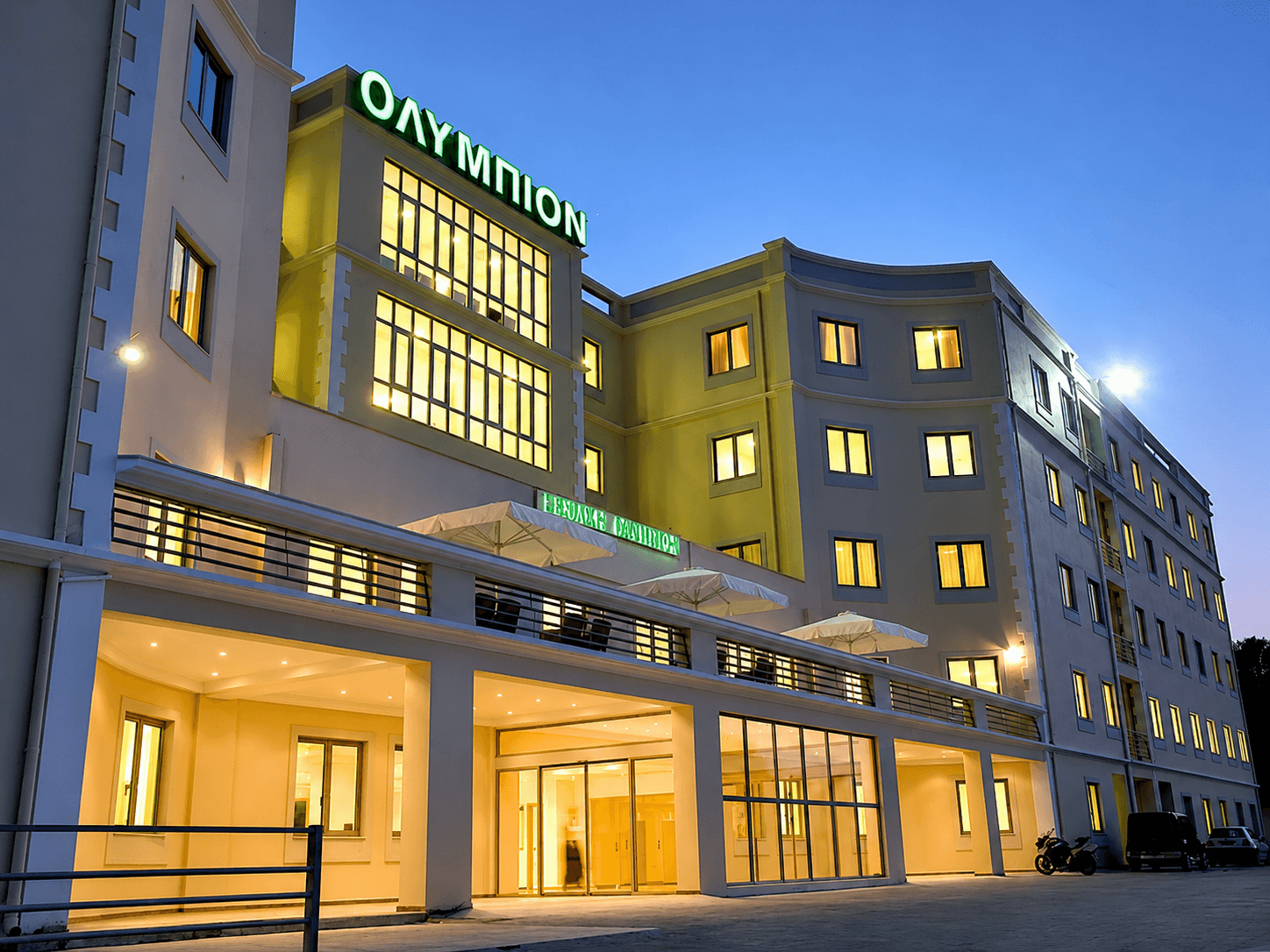 Olympion Medical Center — exterior at dusk